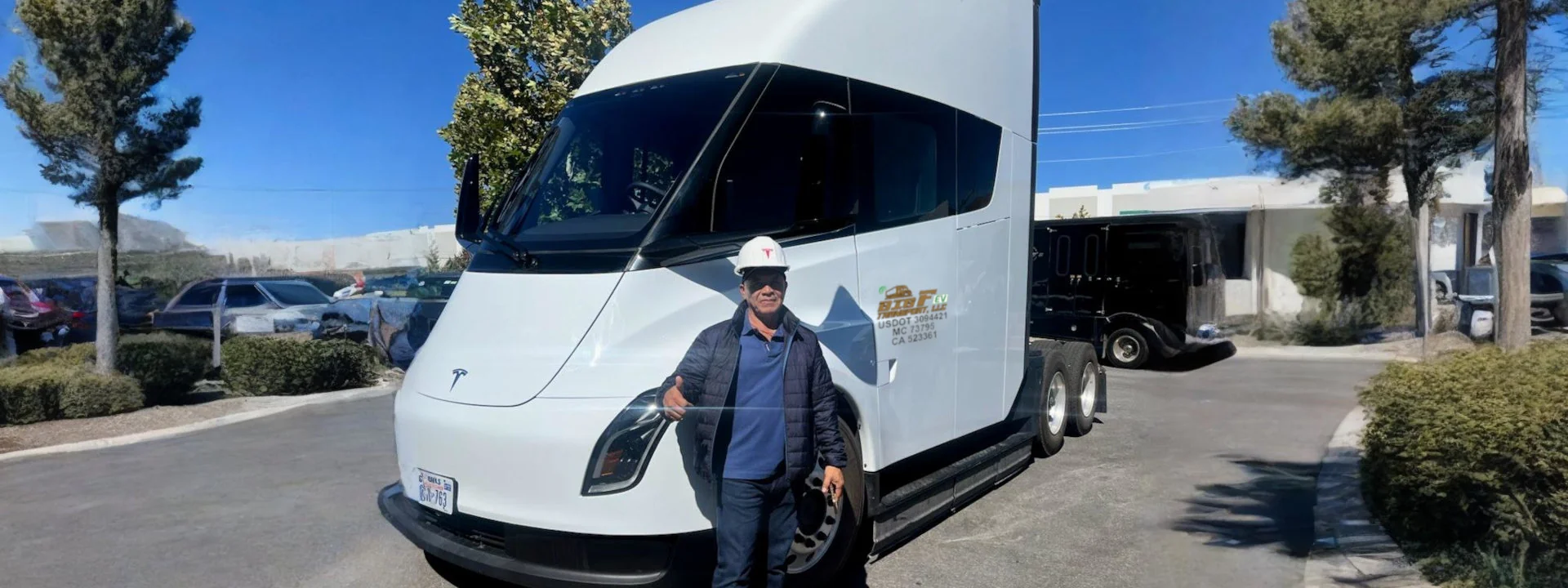 owen with EV truck branded